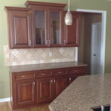 Kitchen Cabinet Refacing, New Countertops, And Tile Backsplash Installation In Olathe